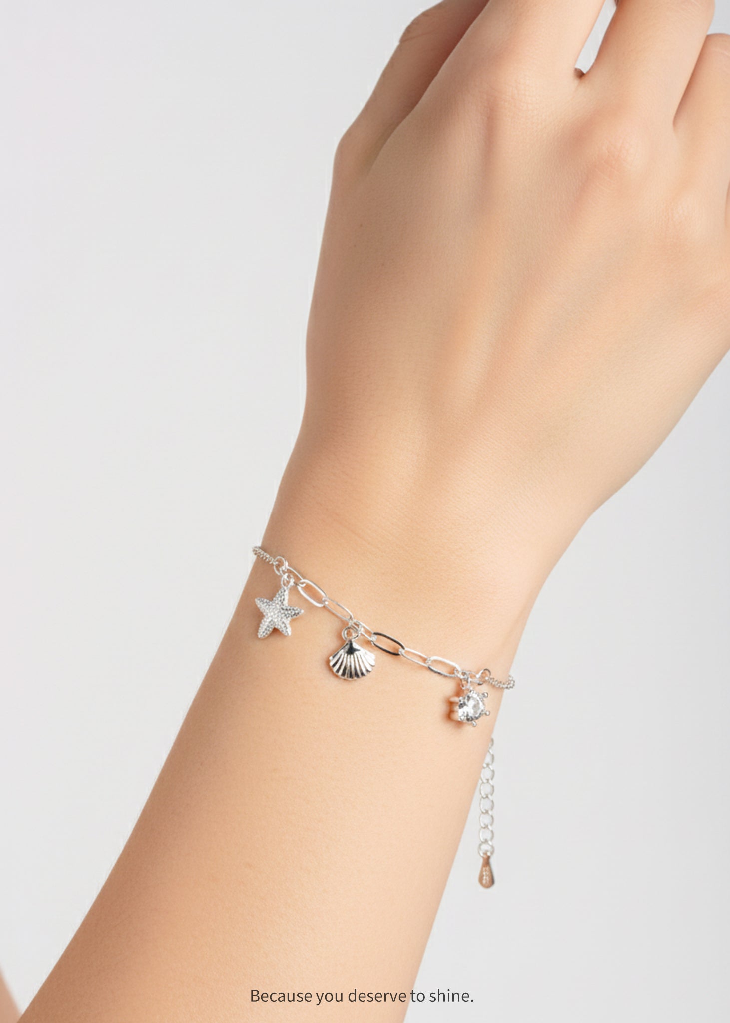 The Timeless Starfish, Shell, and Solitaire Dangle Bracelet