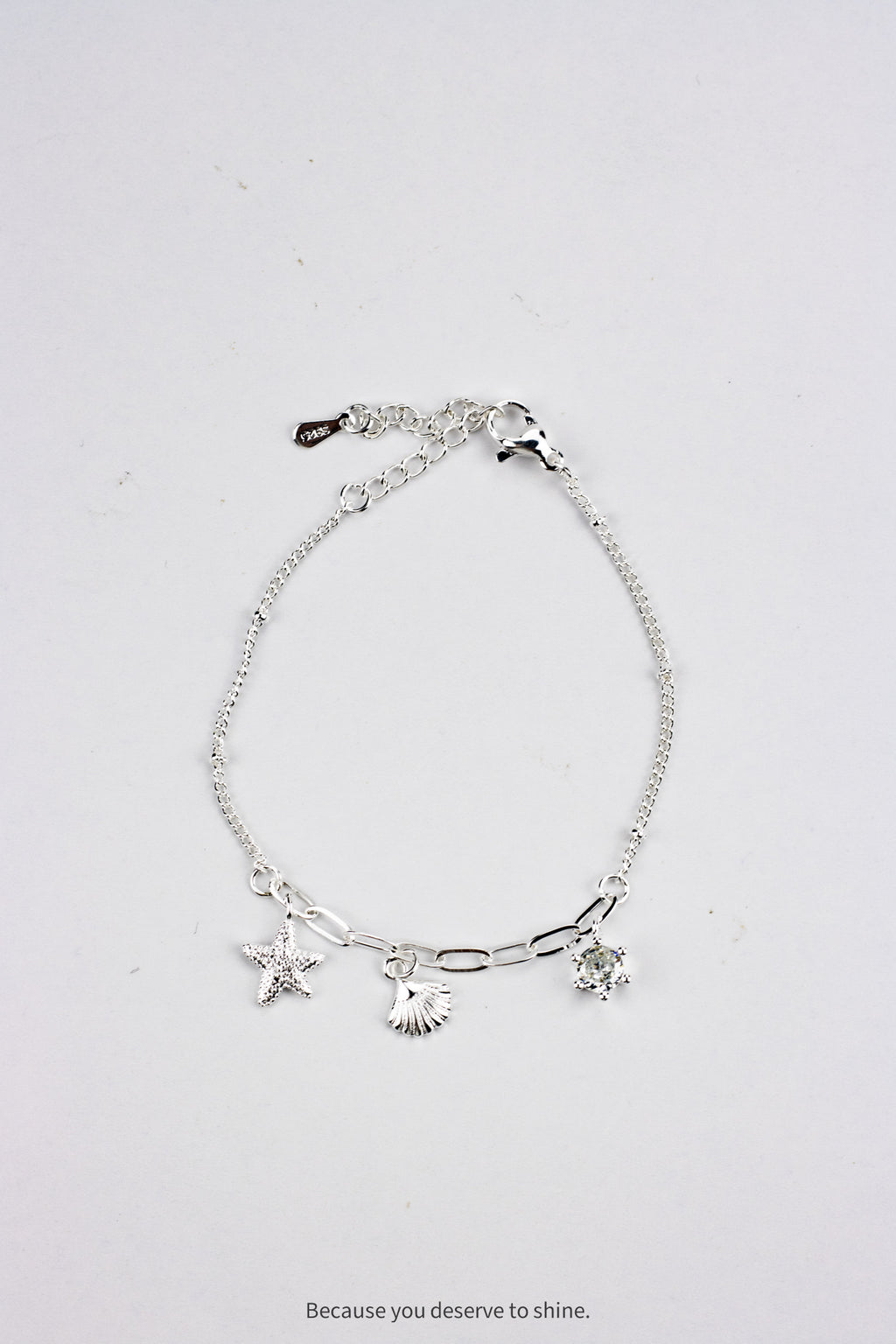 The Timeless Starfish, Shell, and Solitaire Dangle Bracelet