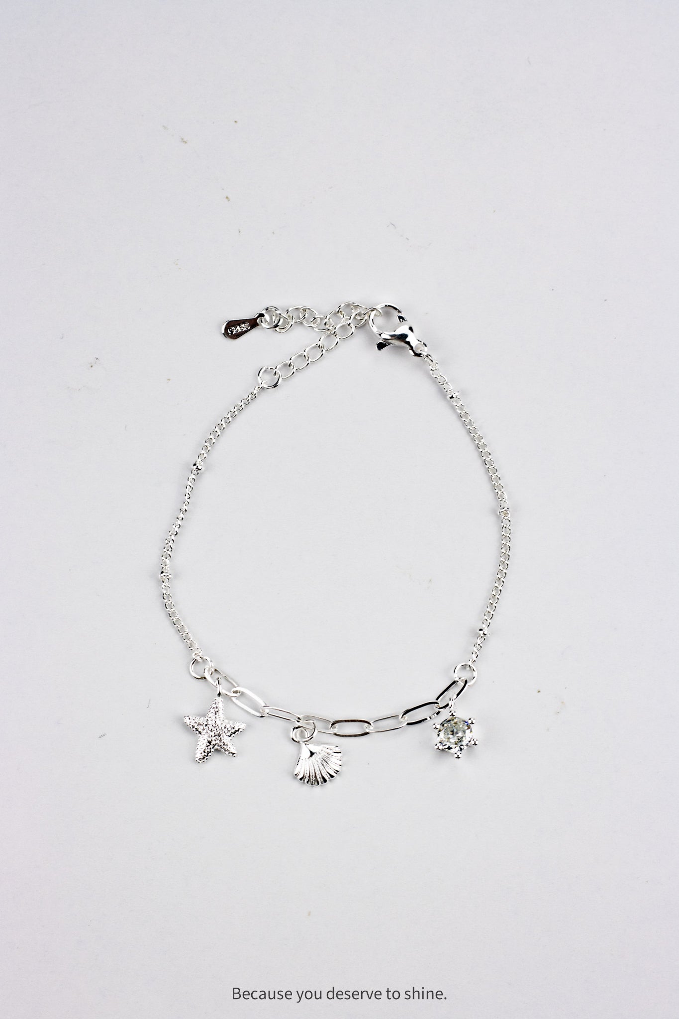The Timeless Starfish, Shell, and Solitaire Dangle Bracelet