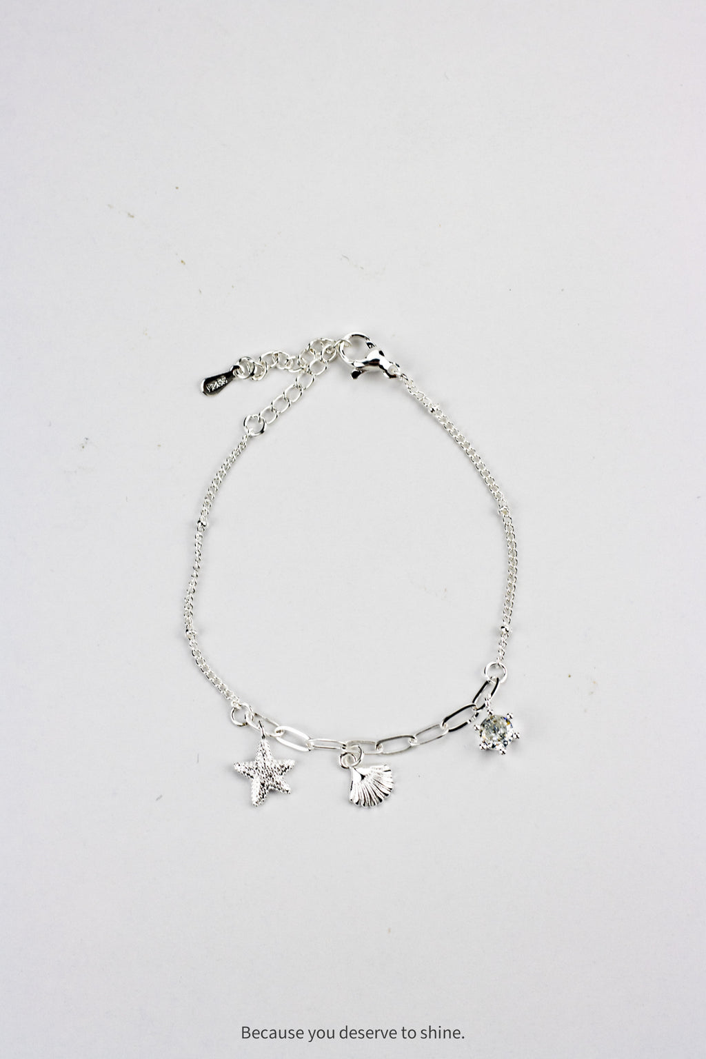 The Timeless Starfish, Shell, and Solitaire Dangle Bracelet