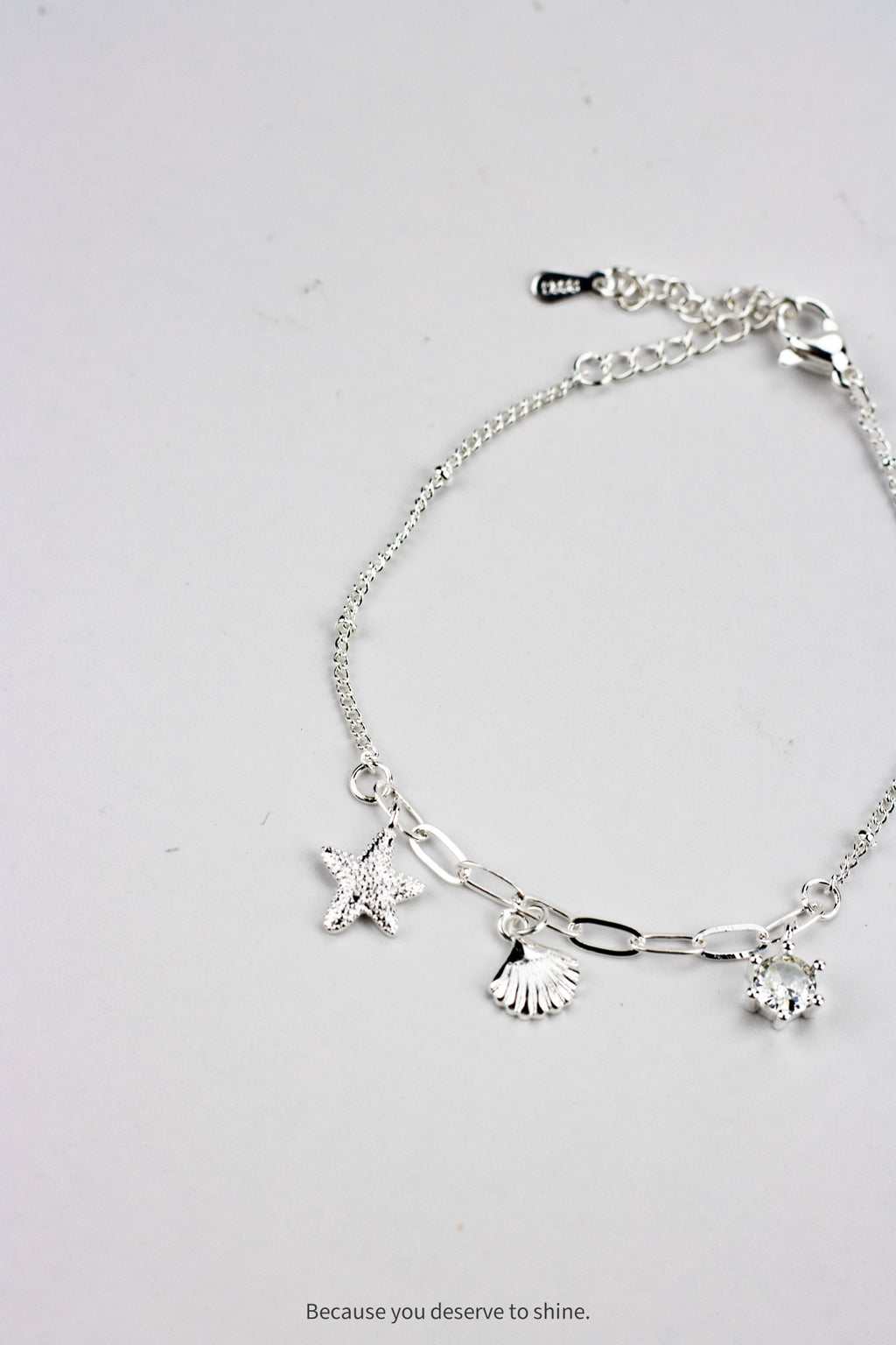 The Timeless Starfish, Shell, and Solitaire Dangle Bracelet